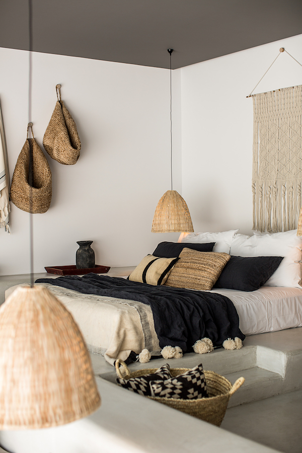 Bedroom with artisan lamps and macrame wall decor